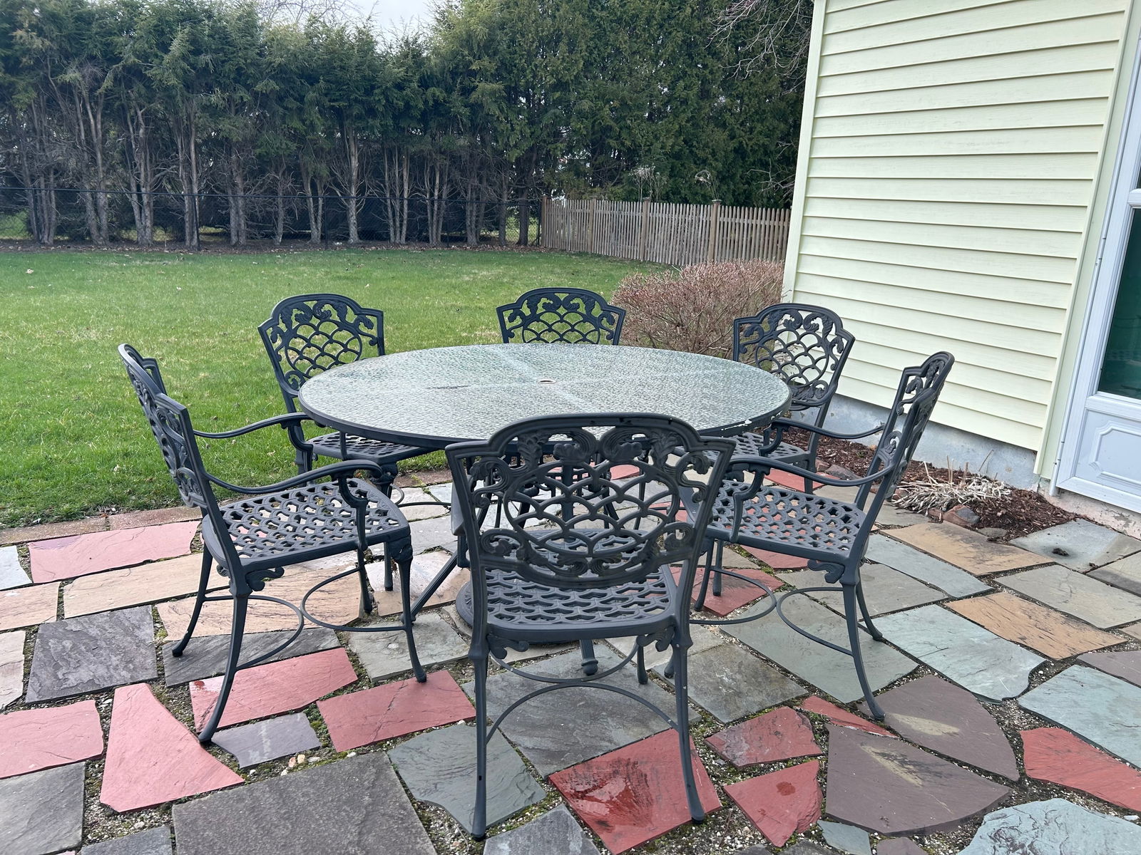 High quality 7 piece patio set. Has large round table with glass top and umbrella holder. 6 arm (1 of 7)