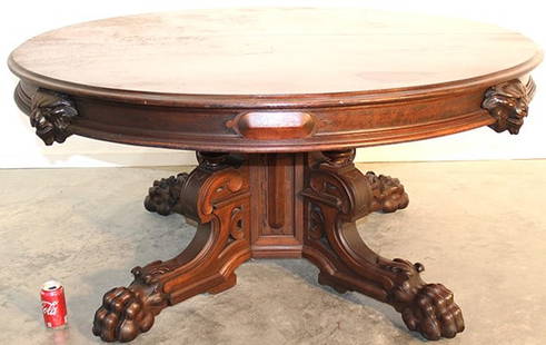 Monumental 60" walnut Victorian banquet table with lion head and (6) 20" leaves (in a walnut leaf: Monumental 60" walnut Victorian banquet table with lion head and (6) 20" leaves (in a walnut leaf holder with a dropleaf), opens to 15'. Has an original middle leg, top has some superficial rings, wil