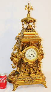 Huge 29" Dore bronze mantel clock marked Japy Freres. Has large wing bird on sides, fancy top to: Huge 29" Dore bronze mantel clock marked Japy Freres. Has large wing bird on sides, fancy top to bottom, porcelain face. Springs are all good (runs for a while). Needs cleaning. 14" wide, 29" tall, 11