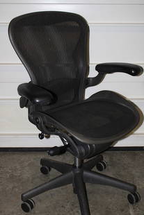 Signed Herman Miller Aeron Chair: Signed Herman Miller Aeron chair. Estate fresh in nice condition. A couple of small pulls in the back (see photo). 29" wide, 42" tall, 25" deep.