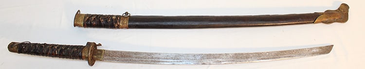 Large Estate Fresh Samuri Sword And Scabbard Signed On The Blade: Large estate fresh Samuri sword and scabbard signed on the blade. Blade has some surface discoloration. Blade is 27.5" to the tsuba, total scabbard is 45". Looks to be a leather scabbard.
