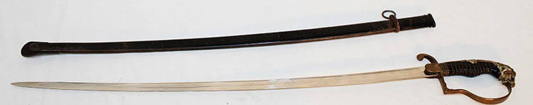 German Imperial Lion Head Sword: German imperial lion head sword. Probably late 1800s marked on the blade W. K. + C. (Weyerberg Kirschbaum). Estate fresh, nice scabbard. Blade is 31" long.