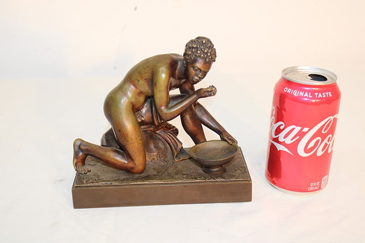19Th C. Bronze Of A Nude Black Man Eating From A Bowl: 19th C. bronze of a nude black man eating from a bowl. Estate fresh in great patina. 7" wide, 6" tall, 3" deep.