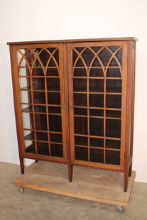 2 Door Inlaid Mahogany Bookcase: 2 door inlaid mahogany bookcase. Adjustable shelves, raised panel back. C. 1900-1920s. Old finish, original key. 47" wide, 56" tall, 14" deep.