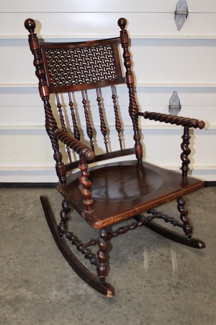Nice Mahogany Merklin Brothers Rocker: Nice mahogany Merklin Brothers rocker with flame twist spindle wooden mesh back. Estate fresh. 24" wide, 42" tall, 24" deep.