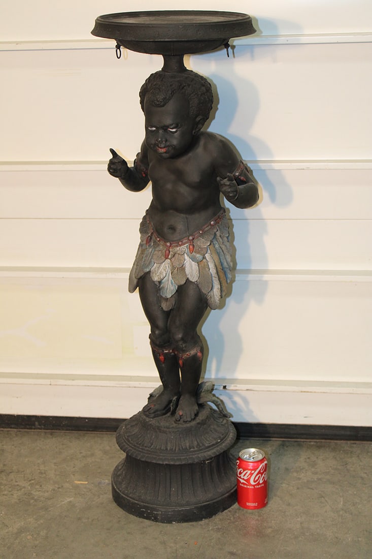 Incredible Antique Spelter Blackmoor Pedestal: Incredible antique Spelter blackmoor pedestal. Colored feather skirt. Estate fresh in nice condition. 12" wide, 41" tall.