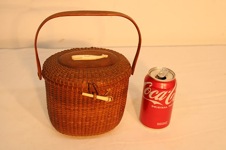 Antique Nantucket Basket With Swing Handle Signed Jose Formoso Reyes: Antique Nantucket basket with swing handle signed Jose Formoso Reyes. Estate fresh in nice condition. Has a carved whale on top. One back hinge is detached but there. Appr. 8" wide, 10" tall.