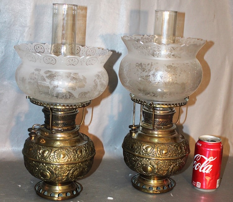 2 Antique Victorian Brass Lamps Marked "The Miller Lamp": 2 antique Victorian brass lamps marked "The Miller Lamp". Never been electrified, original patina. 2 antique etched shades - 1 floral, 1 scenic. Pittsfield MA estate. 8" wide, 16" tall.