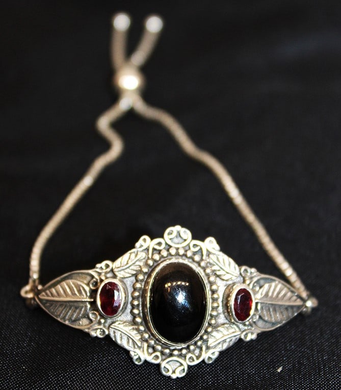 Pretty sterling silver bracelet with gemstones. Slide chain marked 925. Very elaborate. Hinsdale: Pretty sterling silver bracelet with gemstones. Slide chain marked 925. Very elaborate. Hinsdale estate.