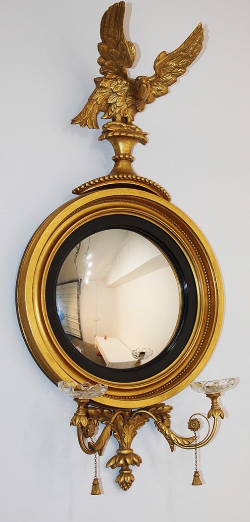 Exceptional Williamsburg federal style convex looking glass. Has an eagle with outspread wings and 2: Exceptional Williamsburg federal style convex looking glass. Has an eagle with outspread wings and 2 candelabra arms. Estate fresh in real nice condition. 17" wide 36" tall.