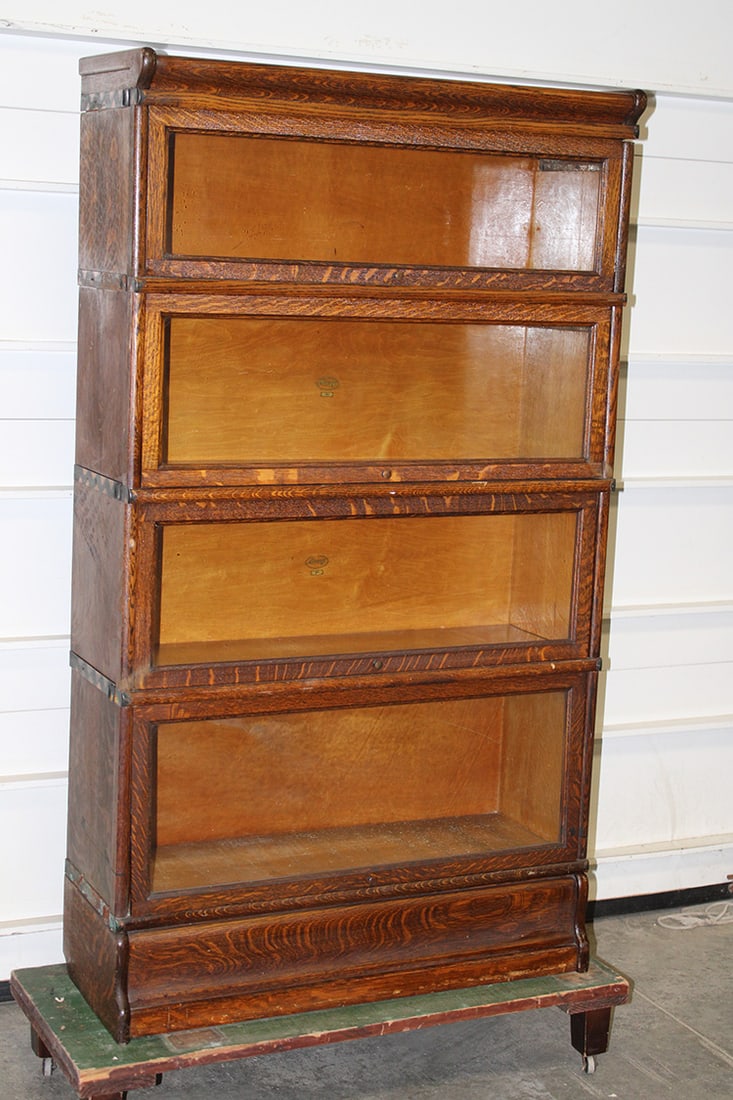 Tall 4 section oak Macy's stacking bookcase in nice condition. The bottom section needs replacing (1 of 5)