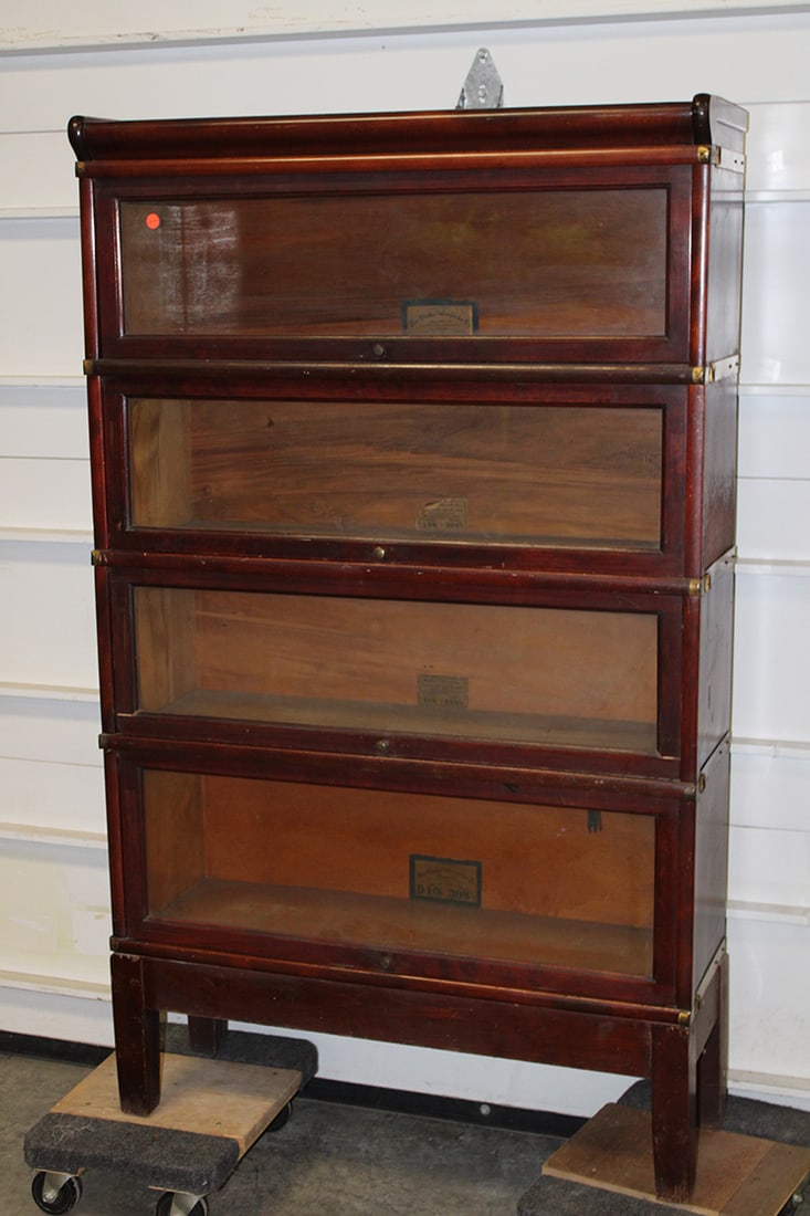 4 section Globe Wernicke stacking bookcase. Mahogany finish, D-size, model 398 1/2. Estate fresh in: 4 section Globe Wernicke stacking bookcase. Mahogany finish, D-size, model 398 1/2. Estate fresh in nice condition. 34" wide, 58" tall, 12" deep.