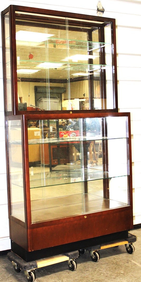 Sweet 2 piece step back glass display case. Sliding glass doors on the top and bottom, mirrored: Sweet 2 piece step back glass display case. Sliding glass doors on the top and bottom, mirrored back. Great for a shop or collectors. 36" wide, 70" tall, 14" deep.