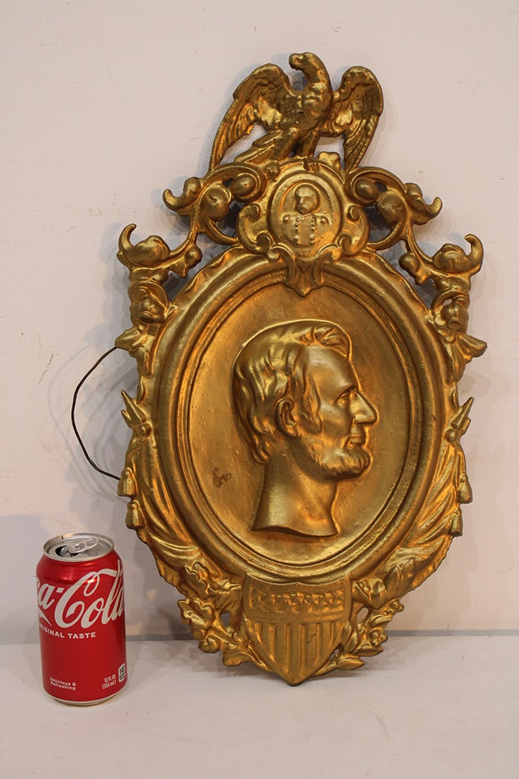 Wonderful cast iron plaque possibly Civil War era of Lincoln, shield with stars and stripes,: Wonderful cast iron plaque possibly Civil War era of Lincoln, shield with stars and stripes, soldiers bust with an eagle crest signed Rome on the back. Has a gold finish. 12" wide, 19" tall.
