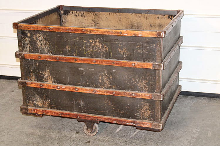 Great early 1900s industrial cart. Wood slat side, 4 large iron wheels (2 that swivel) rolls. Real: Great early 1900s industrial cart. Wood slat side, 4 large iron wheels (2 that swivel) rolls. Real nice. 40" wide, 30" tall, 29" deep.