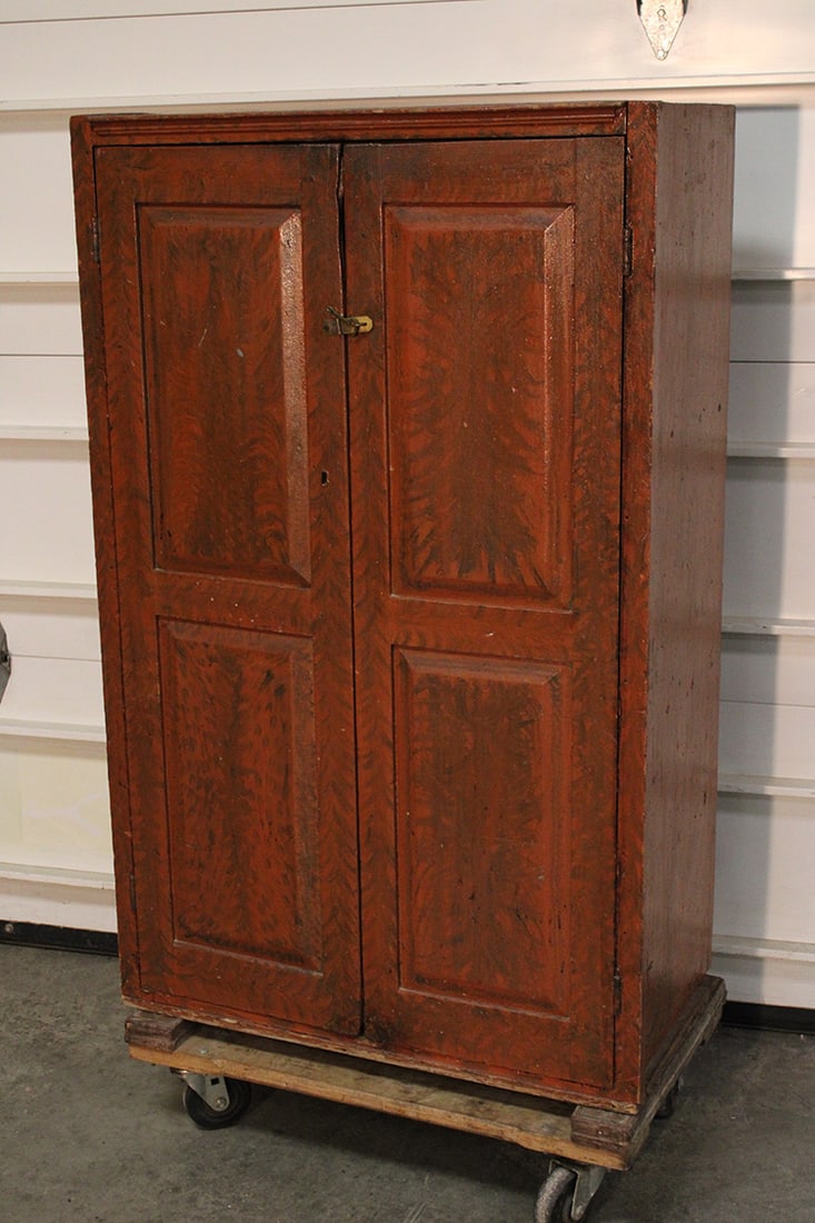 Period raised panel 2 door cupboard 2 board back. Chatham estate, grained painted. Mortis and pinned: Period raised panel 2 door cupboard 2 board back. Chatham estate, grained painted. Mortis and pinned doors. Nice condition. 31" wide, 50" tall, 17" deep.