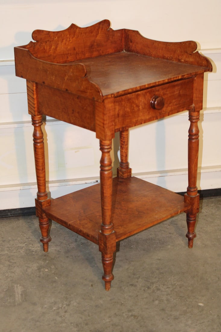 Period birds eye maple 1 drawer night stand. Nicely turned legs and cut out splash. Stockbridge: Period birds eye maple 1 drawer night stand. Nicely turned legs and cut out splash. Stockbridge estate. 21" wide, 33" tall, 17" deep.