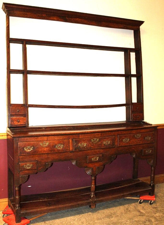 18th C. oak Welsh cupboard. 2 piece, nice fan carvings on the bottom, Has warps for character of a: 18th C. oak Welsh cupboard. 2 piece, nice fan carvings on the bottom, Has warps for character of a 300 year old piece. Stockbridge estate. 64" wide, 82" tall, 15" deep.