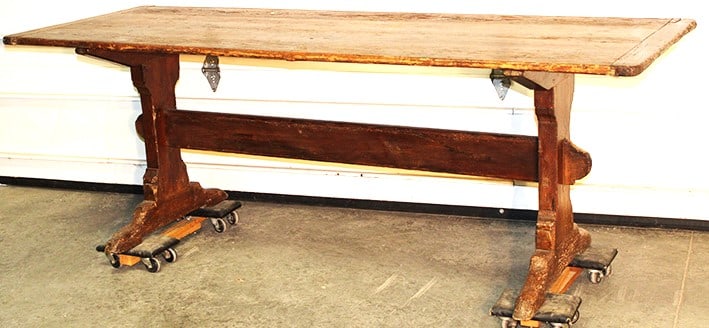 Early country farm house 7' dining table with trestle base, 3 board top with bread board ends. Very: Early country farm house 7' dining table with trestle base, 3 board top with bread board ends. Very rustic. Has wear consistent with age. Stockbridge estate. 84" wide, 29" tall, 32" deep.