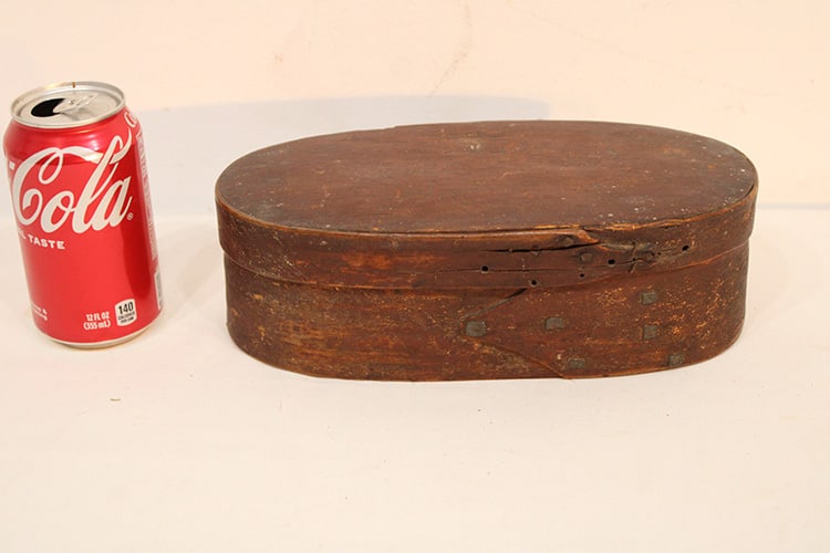 Early 19th C. oval pantry box, possibly shaker. Has remanence of red with hand hammered square nail.: Early 19th C. oval pantry box, possibly shaker. Has remanence of red with hand hammered square nail. Estate fresh. 10.5" wide, 3.5" tall, 5.5" deep.