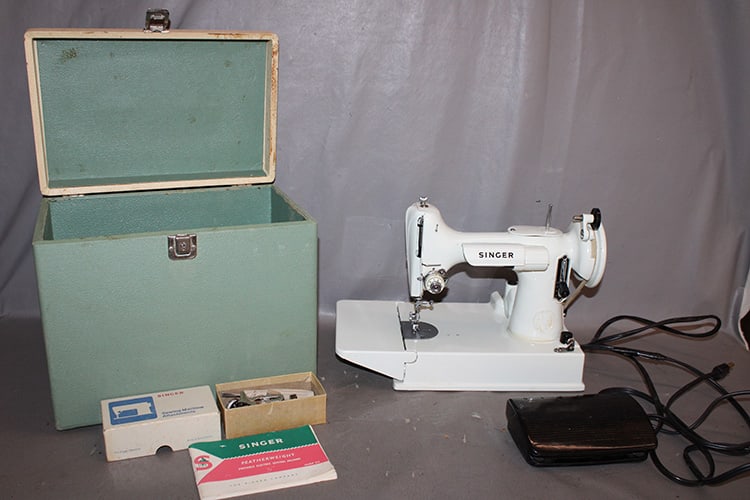 Unusual Singer featherweight 221k sewing machine in white. Has the original book, box of (1 of 5)