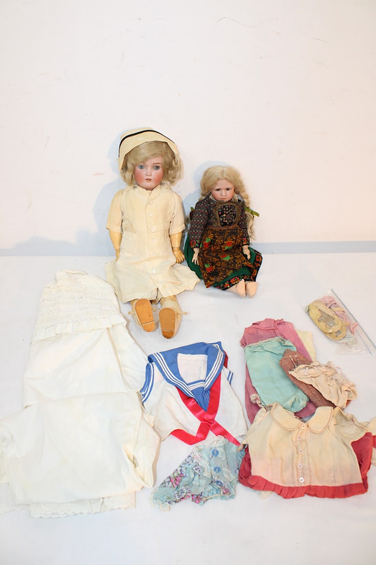 2 real nice antique bisque dolls (1) Simon Halbig, (1) Germany. Both nicely dressed in nice: 2 real nice antique bisque dolls (1) Simon Halbig, (1) Germany. Both nicely dressed in nice condition. Selection of extra clothes. Estate fresh.