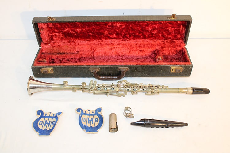 American Triumph clarinet. Looks to be nickel plated. Serial #25031 from a local estate in the: American Triumph clarinet. Looks to be nickel plated. Serial #25031 from a local estate in the original case and mouthpieces. La Chapelle. Appr. 26" long plus 2 patches.