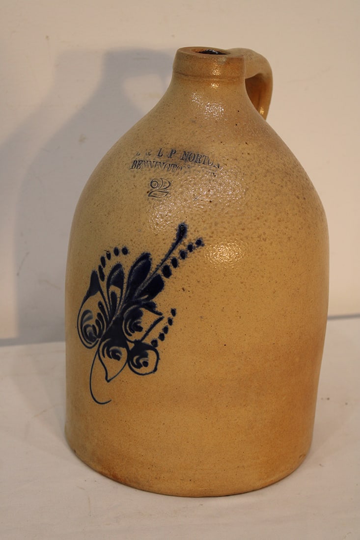 E & LP Norton Bennington 2 gallon jug with cobalt flower. No chips or cracks, some browning on the (1 of 3)