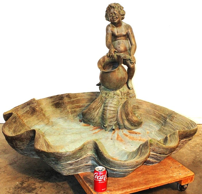 Huge Solid Bronze Garden Fountain With Putti: Huge solid bronze garden fountain with putti pouring water from an urn. Has a massive clam shell base in a super original patina. Well over 100lbs. Estate fresh. Appr. size 53" wide, 38" tall, 48" dee