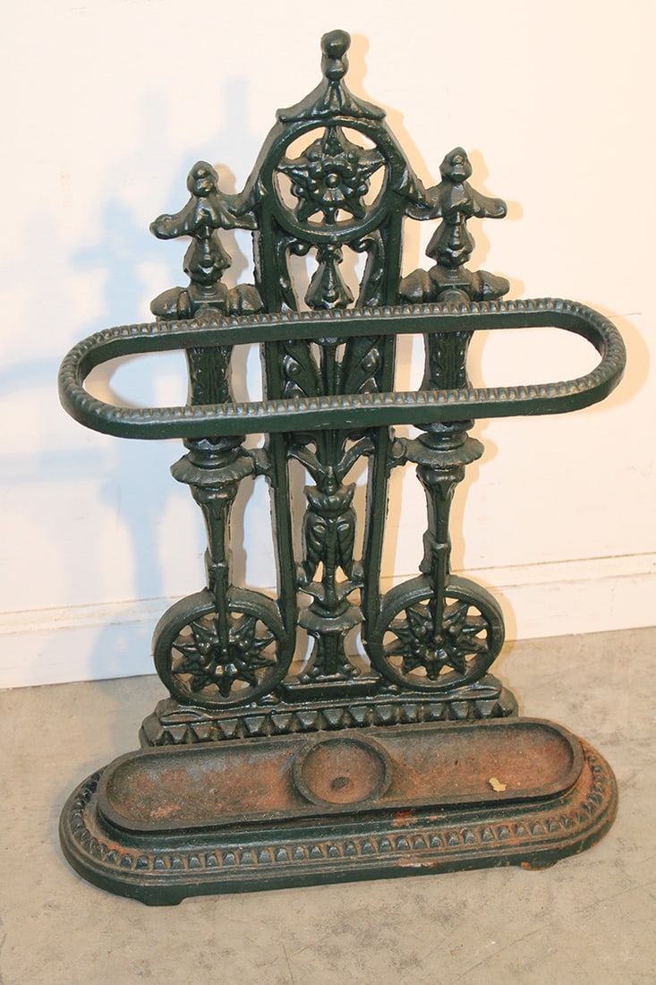 Fancy Cast Iron Umbrella Rack: Fancy cast iron umbrella rack in a nice green finish. Art deco look. No cracks or breaks. 19" wide, 27" tall, 6" deep.