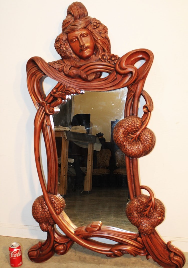 Wonderful 54" Art Nouveau Style Mirror: Wonderful 54" art nouveau style mirror with carved woman on the top. Large accentuated nouveau carvings. Looks to be mahogany or something similar. Appr. Size is 34" wide, 54" tall, 4" deep.