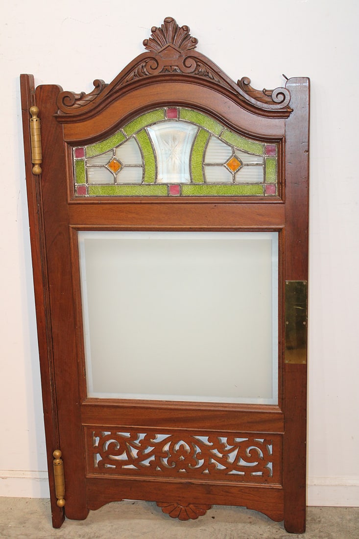 Super Mahogany Sloon Door With Beveled Leaded Glass: Super mahogany sloon door with beveled leaded glass. Peirce carved mahogany, 2 way brass hinges with a carved crest C. 1880. Plate to attach it to the wall. 26" wide, 51" tall, 2" deep.