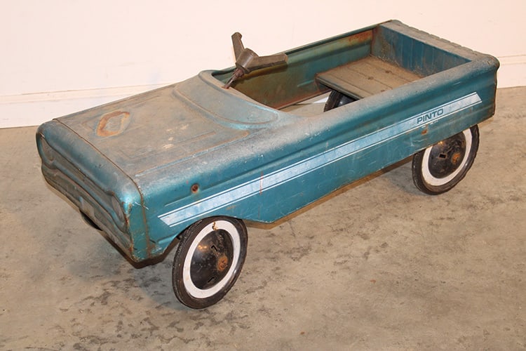 Amf Pinto Pedal Car 1970s: AMF Pinto pedal car 1970s in working condition. Old original color and stenciling. Would look nice restored. 34" wide, 13" tall, 15" deep.