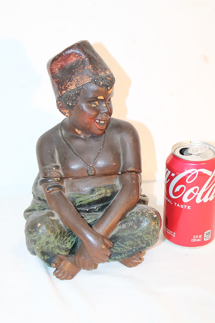 Rare 19Th C. 2 Piece Tobacco Jar Of A Young Black Man: Rare 19th C. 2 piece tobacco jar of a young black man. Some glaze flakes, no chips or cracks. Nice condition, probably terra cotta. 6" wide, 10" tall, 7" deep.