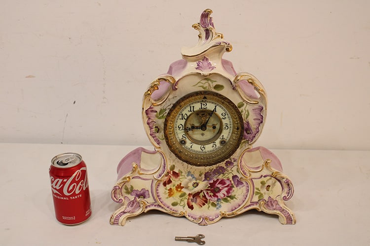 Beautiful Ansonia Royal Bonn China Clock "La Vendee": Beautiful Ansonia Royal Bonn China clock "La Vendee" dated 1882. Springs all good, open escapement, no chips or cracks. Hand painted purple flower motif. Nice condition. Appr. Size 13" wide, 15"