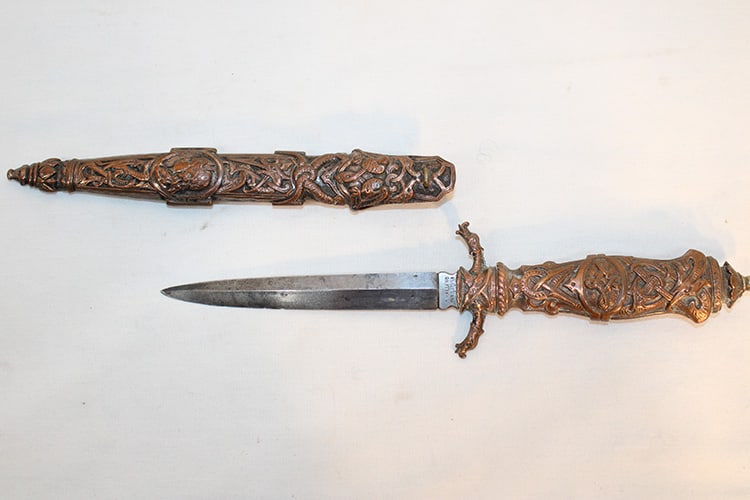 19Th C. Swedish Presentation Dagger And Sheath: 19th C. Swedish presentation dagger and sheath. Blade is marked A. Halling Eskilstuna. Heavy embossed (mythical). Copper tone. Western MA estate in nice condition. Overall length is appr. 8.5".