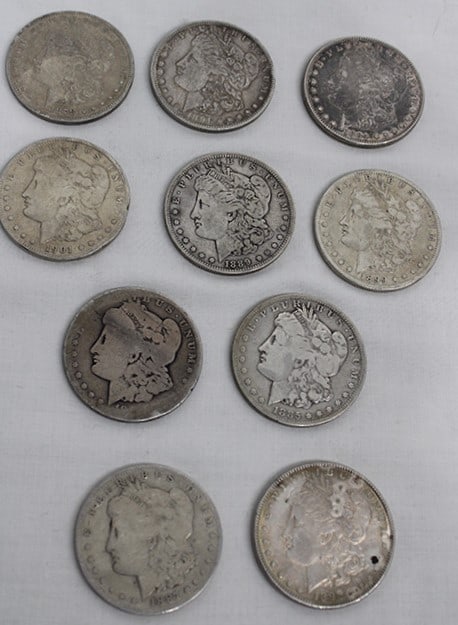 10 Morgan Silver Dollars: 10 Morgan Silver Dollars, 8.4-ozt. Various dates, few have a lot of wear, see photos.