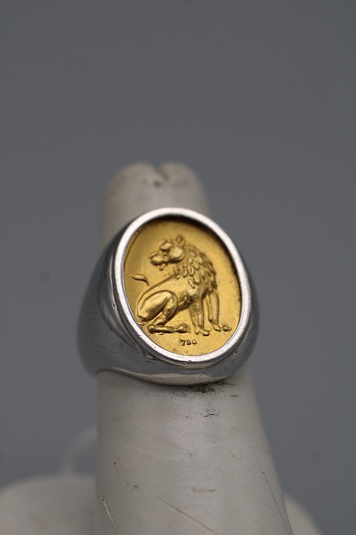 Nice Designer 18K & Sterling Ring by Lial Lalaounis: Nice Designer 18K & Sterling Ring by Lial Lalaounis. With a sterling lion marked 750, size is approximately 6. In nice condition, estate fresh,