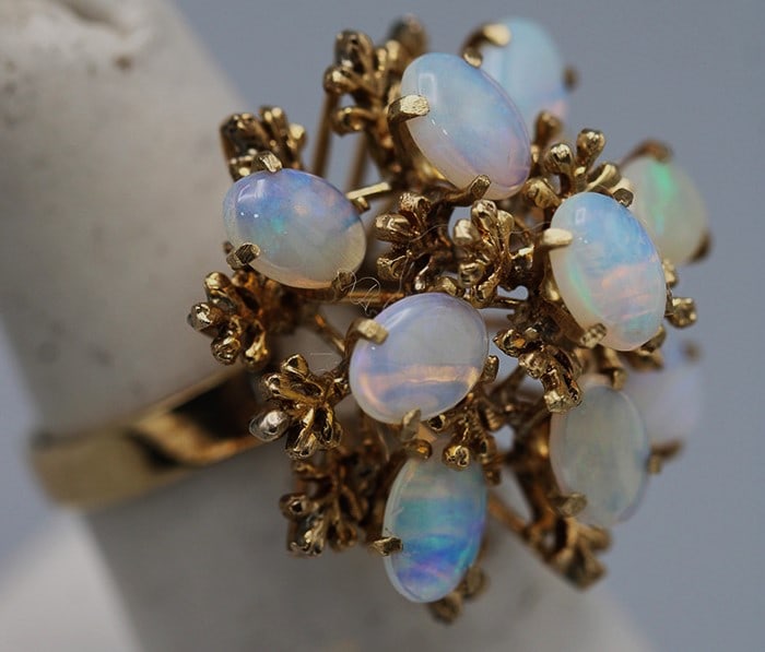 Large 10K Gold Ring with 9 Opals 5.1 Dwt.: Large 10K Gold Ring with 9 Opals 5.1 Dwt. Exquisite dinner ring, approximate size 6. Vermont estate.