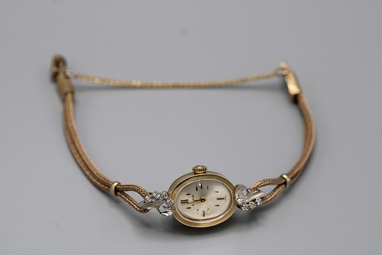 14K Gold Bulova Ladies Watch with Diamonds: 14K Gold Bulova Ladies Watch with Diamonds (Working). 17 jewels, band is not gold. Vermont estate.