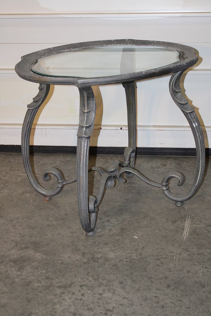 Vintage French Style Glass Top Coffee/ Garden Table: Vintage French Style Glass Top Coffee/ Garden Table. Probably Zinc, has the original beveled glass top with a fancy base. In nice condition with an old finish. 29" wide, 24" tall, 23" deep.
