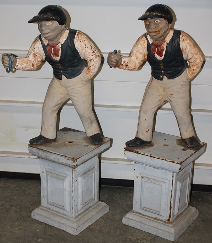 Pair of Antique Cast Iron Lawn Jockeys: Pair of Antique Cast Iron Lawn Jockeys. Looks to be in original paint on a match pair ( for each side of the walkway). 38" tall.