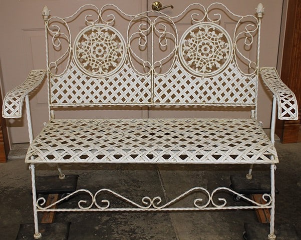 Super Vintage Heavy Wrought Iron Folding Garden Bench: Super Vintage Heavy Wrought Iron Folding Garden Bench. Snow flake design back with an interwoven strap seat, with pineapple finials. In nice condition. 47" wide, 37" tall, 24" deep.