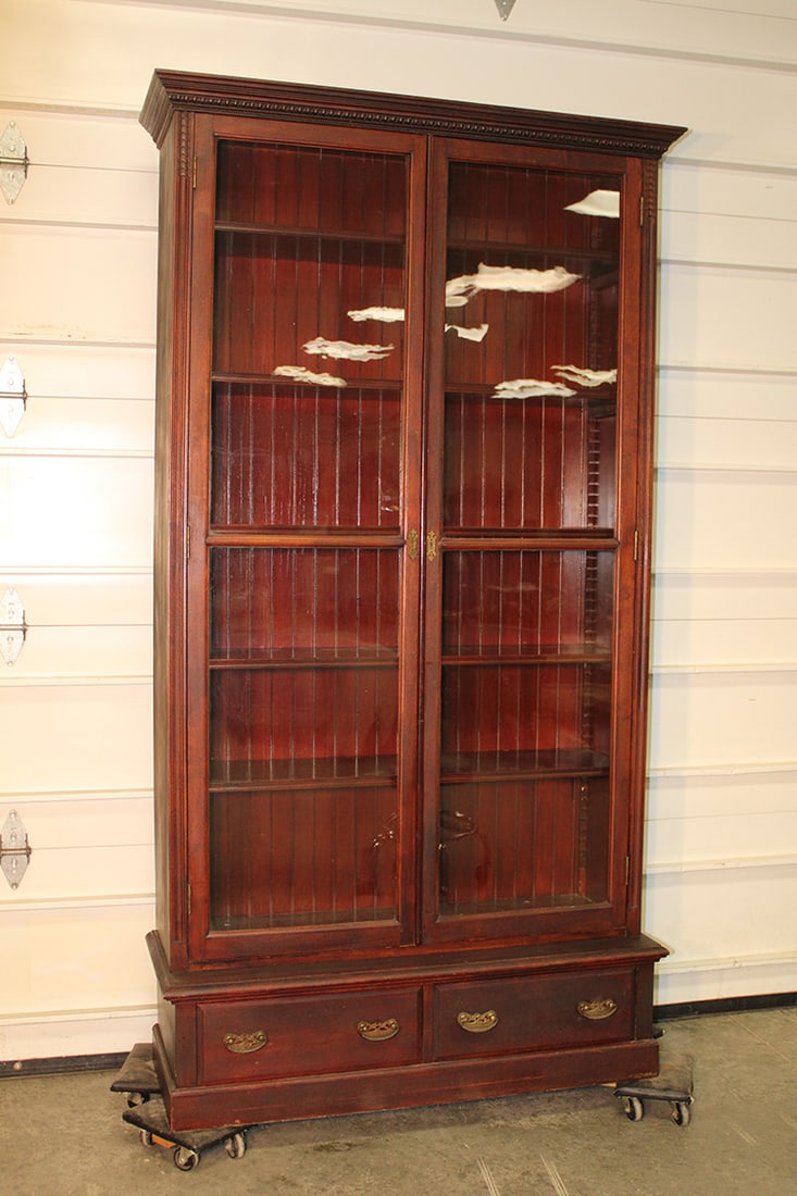 Large Victorian 2 Door Step back Bookcase: Large Victorian 2 Door Step back Bookcase. 2 drawer base, 5 adjustable shelves. Nice and clean from North Adams estate. 44" wide, 84" tall, 16" deep.