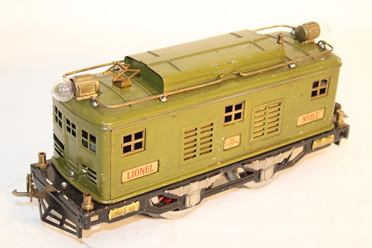 Lionel Prewar Standard Gauge Train No. 8E Electric Locomotive: Lionel Prewar Standard Gauge Train No. 8E Electric Locomotive. Original condition from Agawam, MA estate. Very heavy, has wear, olive green. Approximately 10" wide.