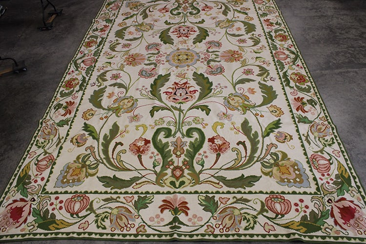 127" X 210" Handmade Needlepoint Rug: 127" X 210" Handmade Needlepoint Rug. Beige, greens, yellows, and reds. With floral motif in the great condition. Richmond estate.