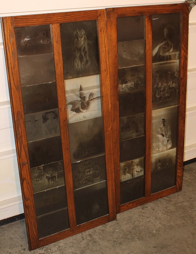2 Oak Doors with Several Great Negatives: 2 Oak Doors with Several Great Negatives. Includes cars, dogs, horses, witch flying on a goose, ect. Only 2 have a small line in the corner. Doors are 19" X 44".