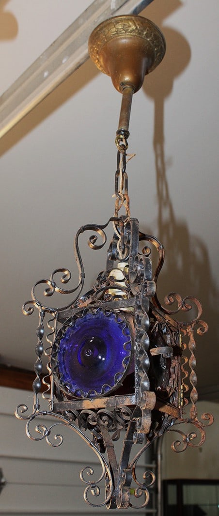 Super 19th Century Wrought Iron Hanging Lamp it Bullseye Glasses: Super 19th Century Wrought Iron Hanging Lamp it Bullseye Glasses. In amber, red and blue colors. Some of the metal needs cleaning, in nice condition overall. Hangs down 27".