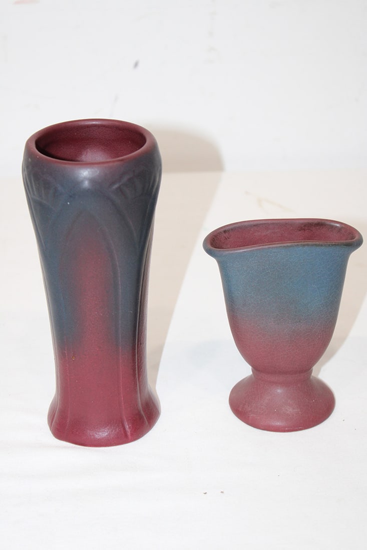 2 Pretty Signed Van Briggle Pottery Vases: 2 Pretty Signed Van Briggle Pottery Vases. Both in matte mulberry and blue glaze. One with floral motif, largest has a 2" line. Estate fresh. Tallest is approximately 7.5" tall.
