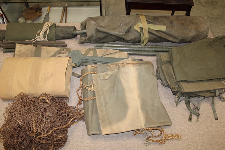Group of WW2 Canvases: Group of WW2 Canvases (tent?) Stretcher. Large bag full of metal poles, not sure if it's all there. North Adams estate.